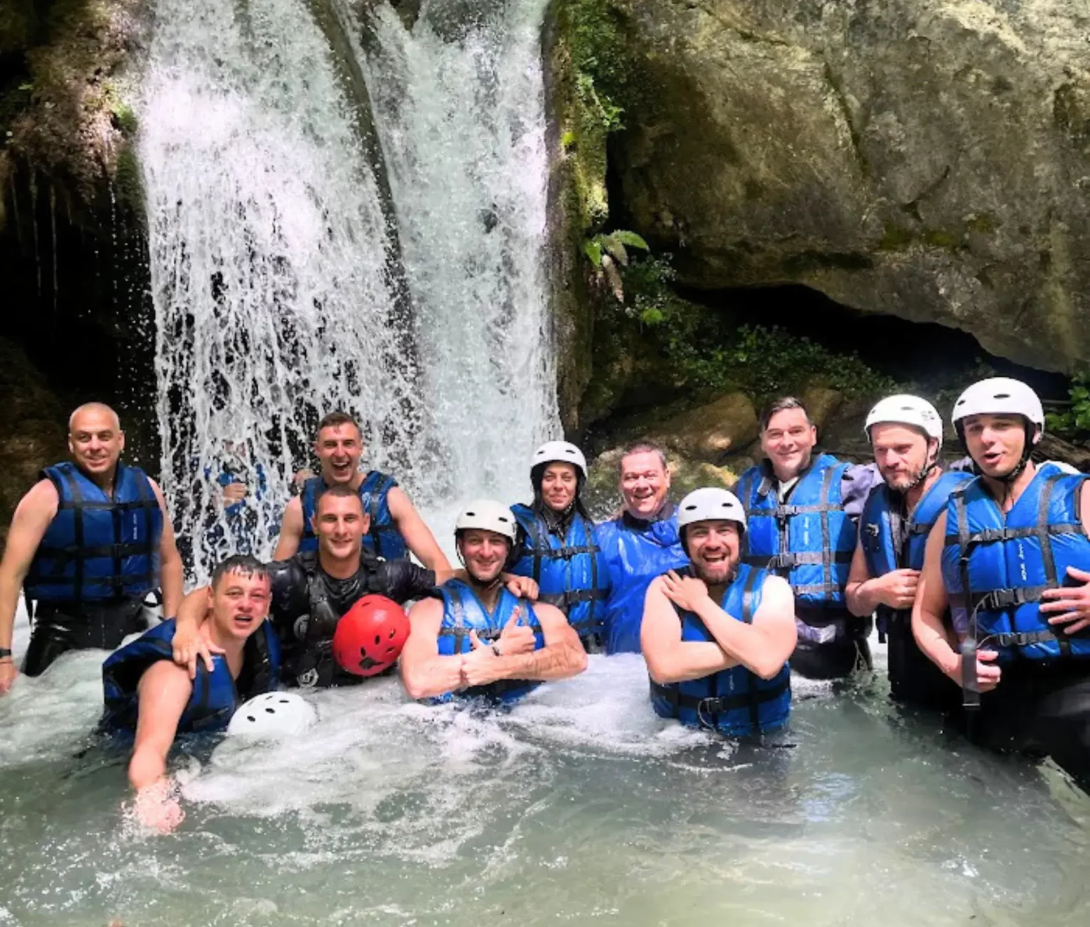 Younify Team Under Waterfall